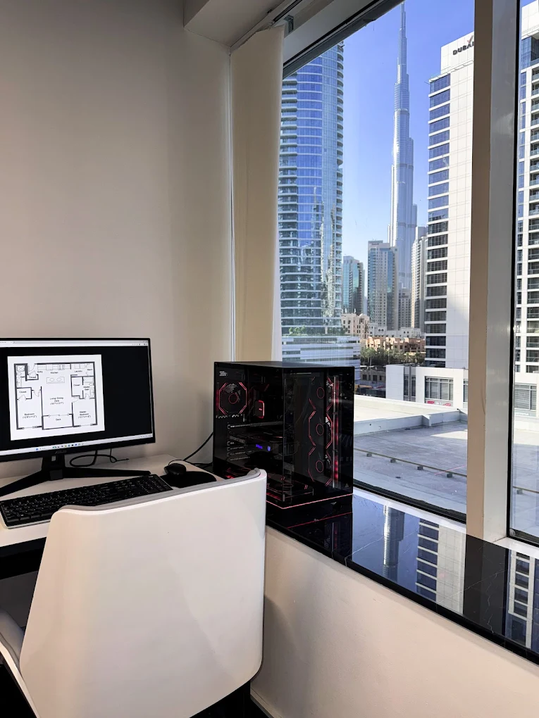 Design workstation overlooking the Burj Khalifa from the Merci Projects studio