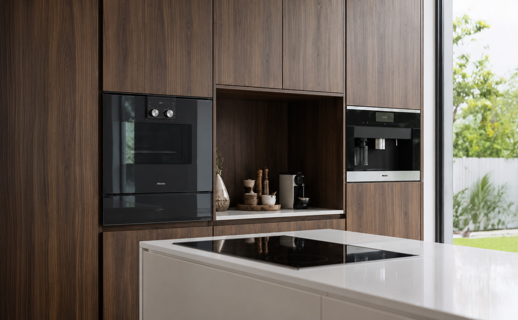 Courtyard Villa kitchen with walnut cabinetry and integrated appliances