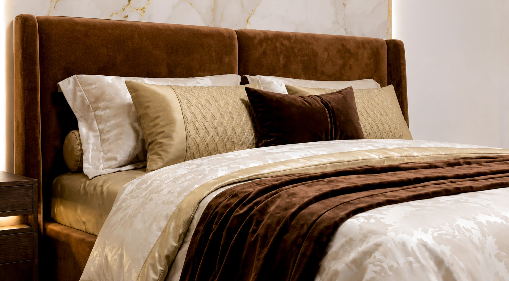 Close-up of the brown velvet headboard and layered bedding