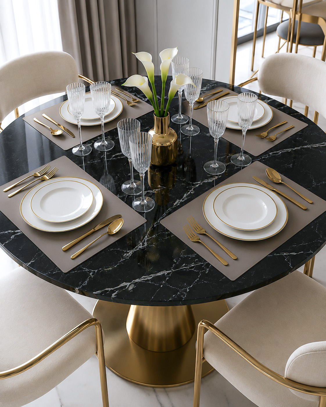 Black marble dining table styled with gold tableware