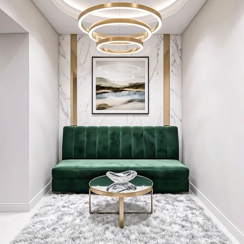 Hall seating nook with green velvet bench and sculptural lighting