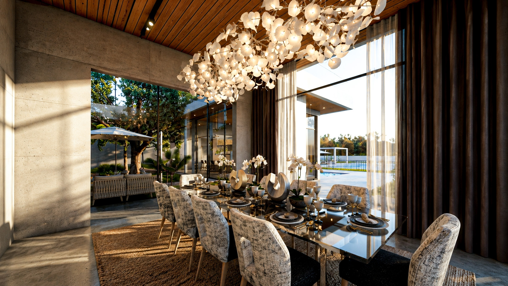 Double-height villa dining area opening to the garden and pool